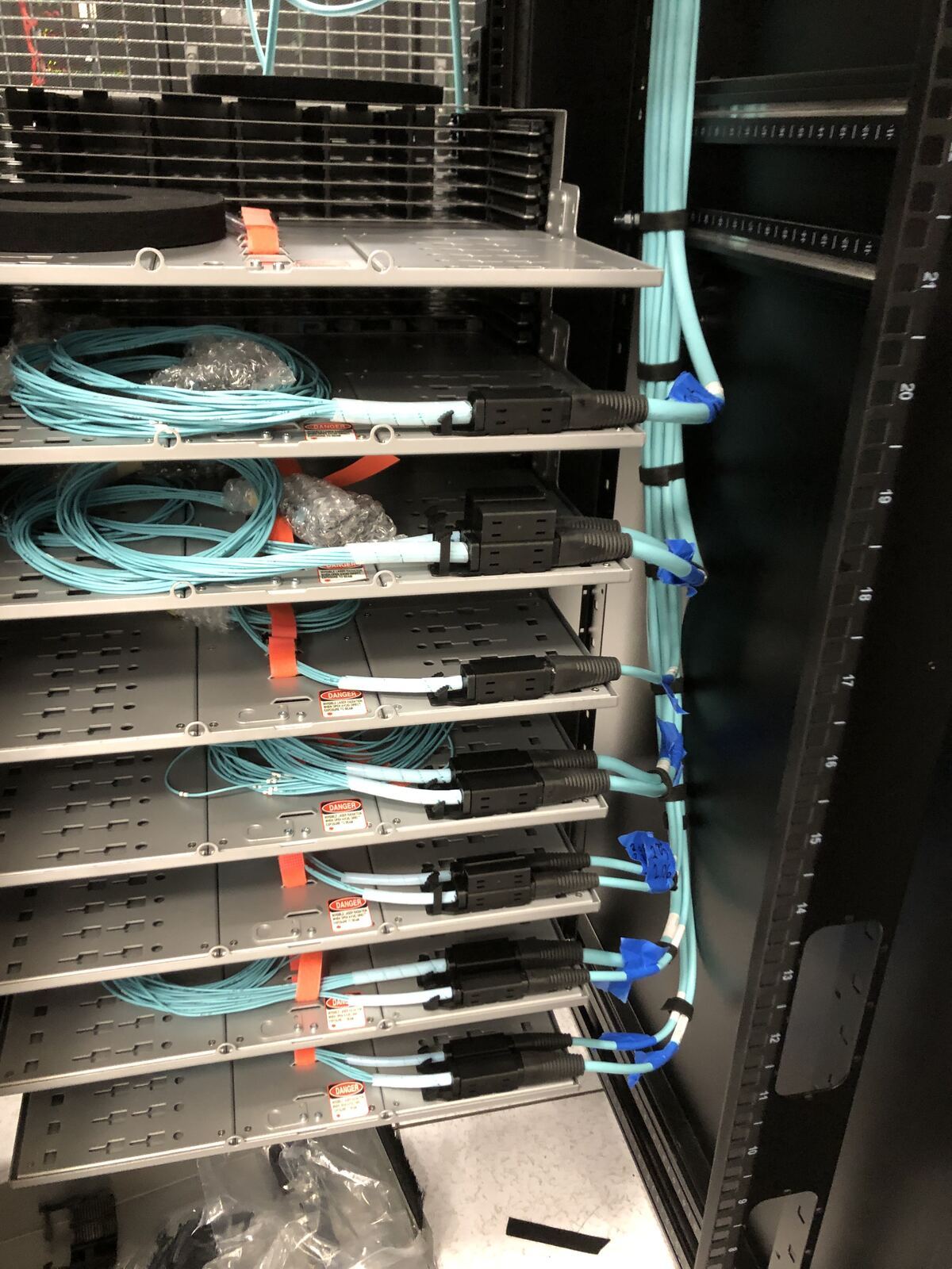 Fiber optic trunk cables terminated at a fiber enclosure